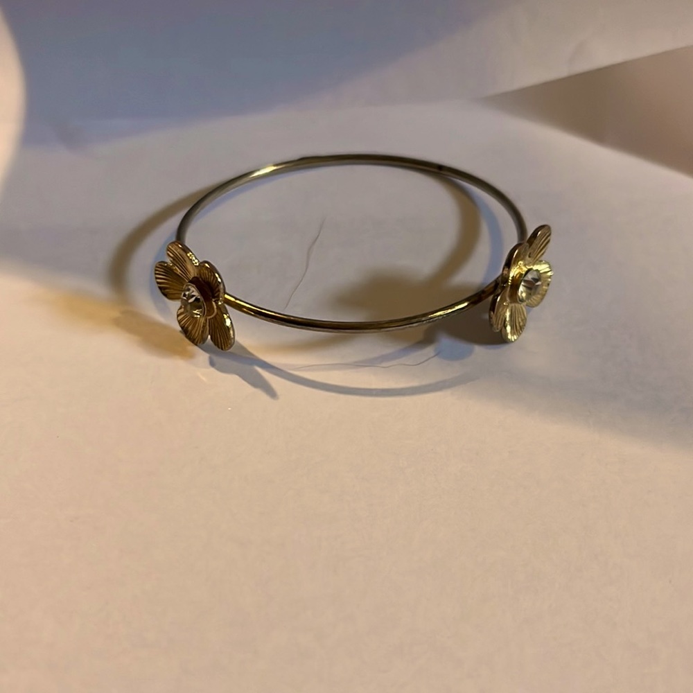 This is a gold flower bracelet.